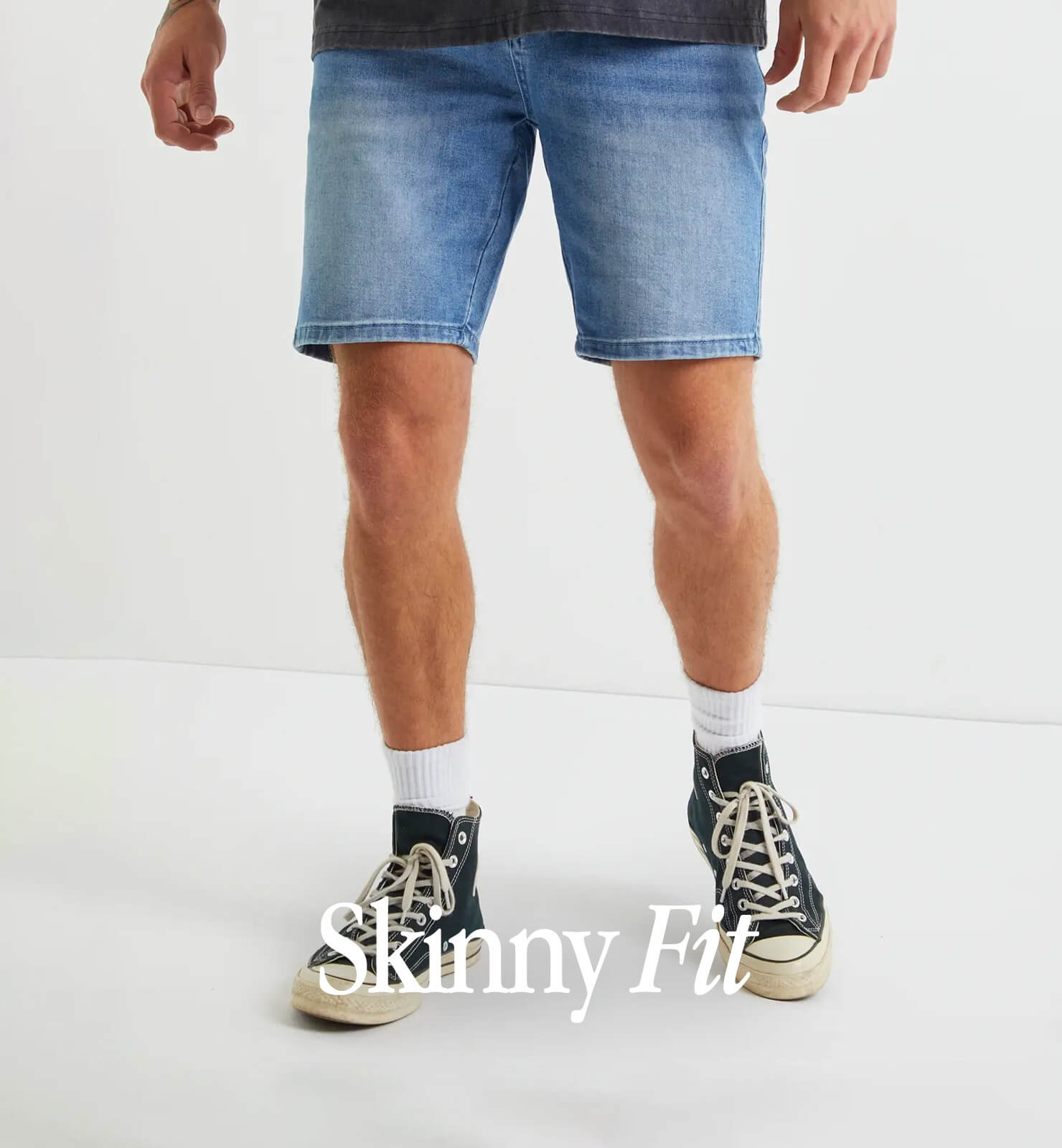 ASOS DESIGN shorter length denim shorts in 90s mid wash with rip