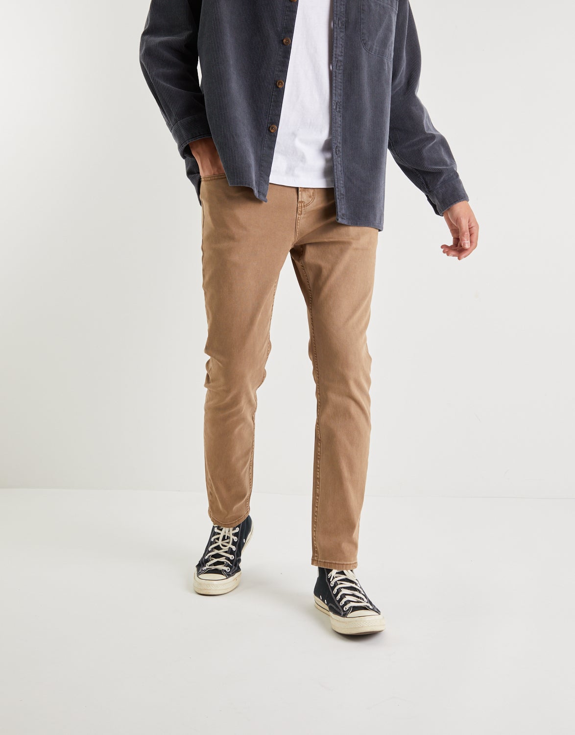 brown tapered jeans