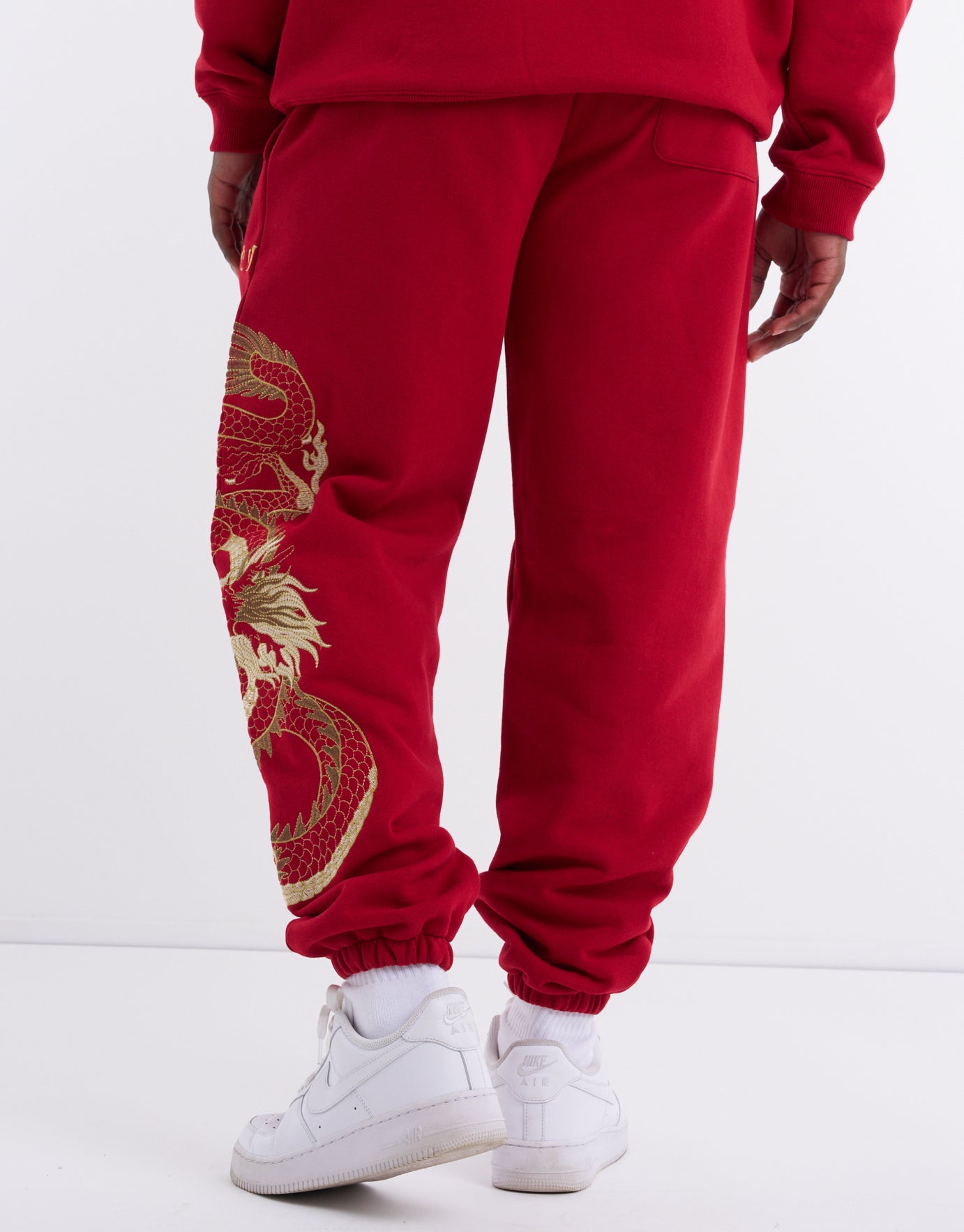 Dragon Gold Embroidered Track Pant in Chilli Red | Hallensteins NZ