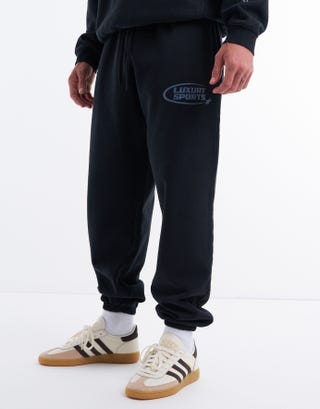 Baggy Leisure Club Cuffed Track Pants in Black