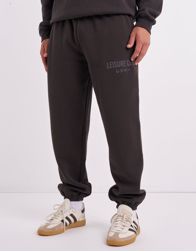 Baggy Leisure Club Cuffed Track Pants in Washed Black | Hallensteins AU